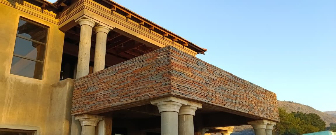 Multicolour slate cladding on a double-storey balcony