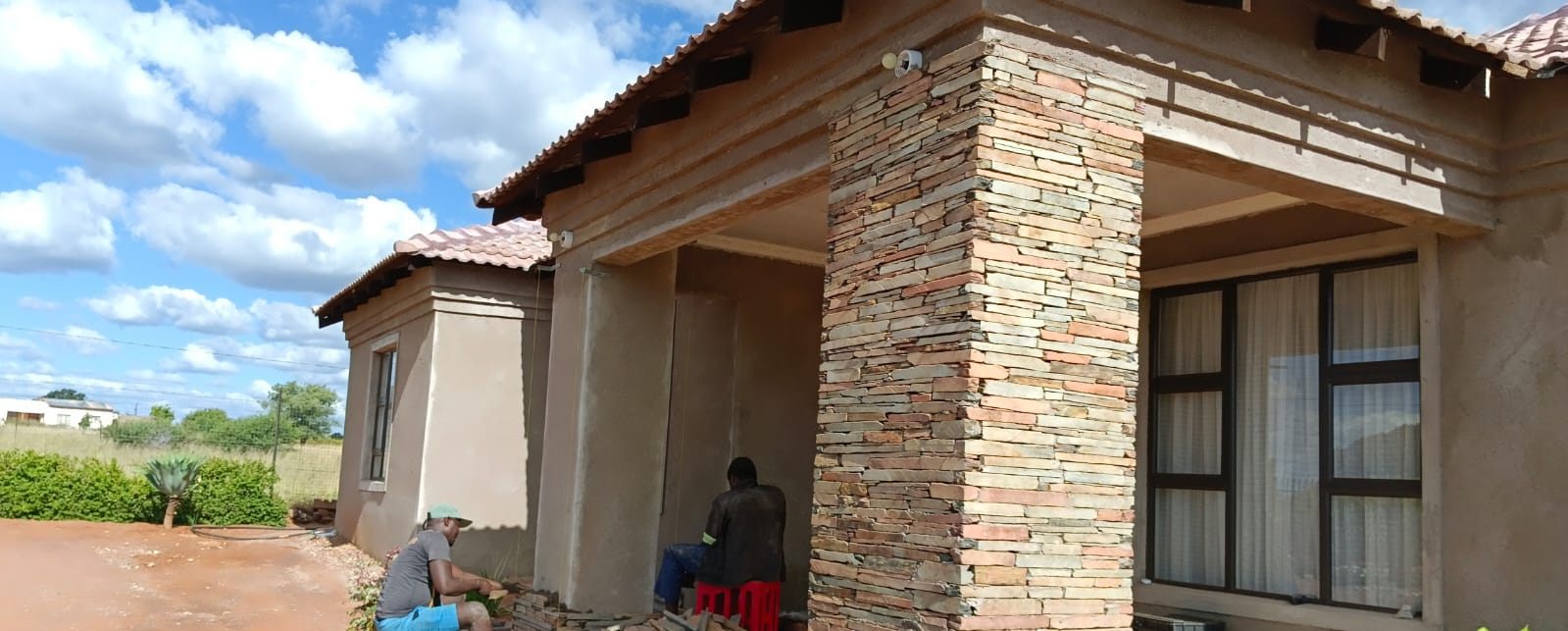 BK Stone Cladding team cladding a porch pillar